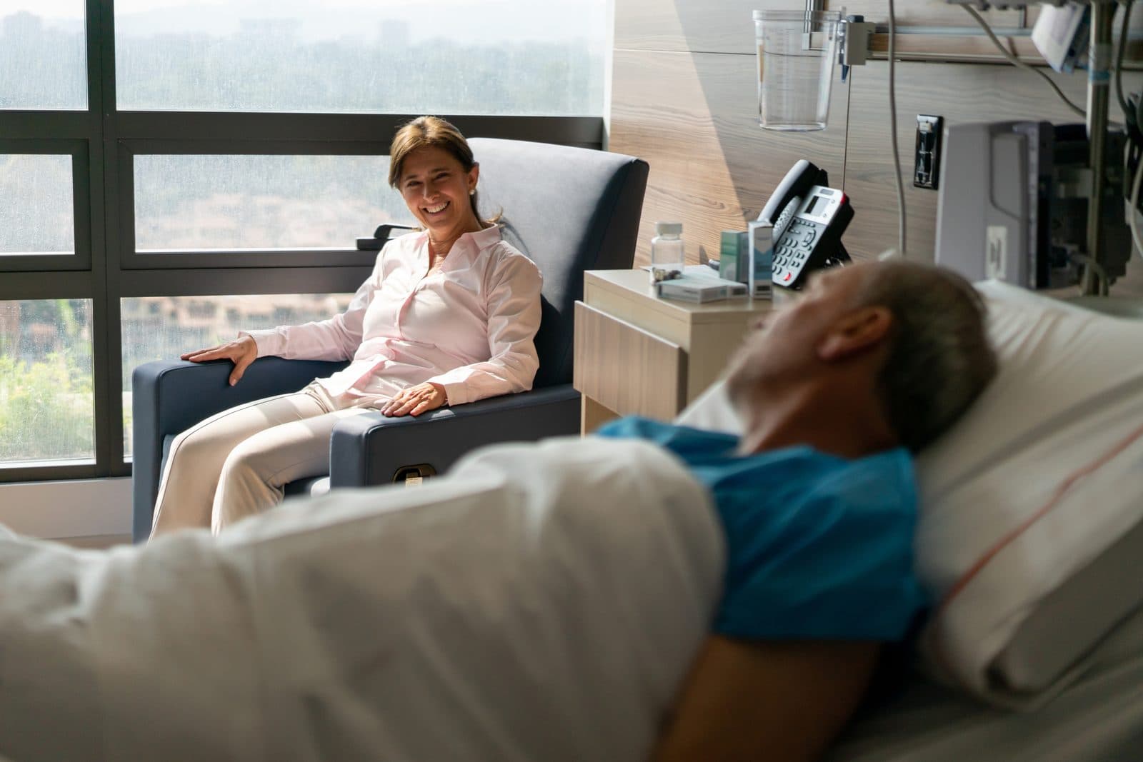Caregiver assisting an elderly patient with daily activities